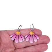 echinace earrings on hand to show their size for reference