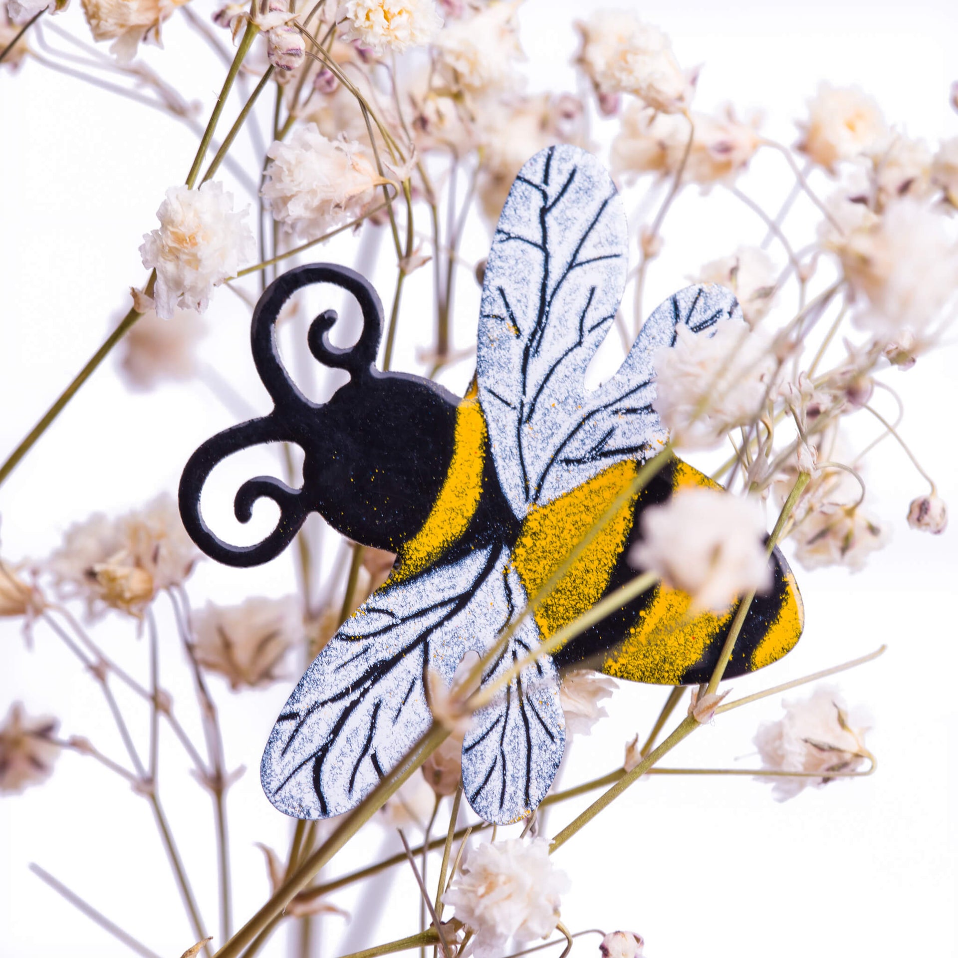 bee brooch in flowers